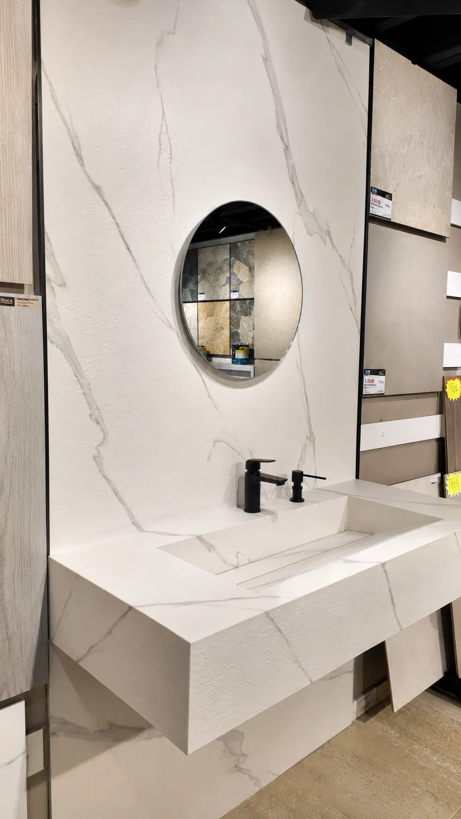 Floating Calacatta vanity with integrated basin and full-height back wall